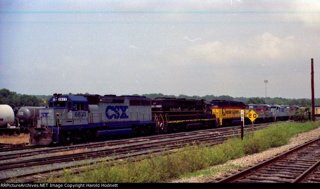 CSX 6623 sits with a variety of power outside the yard office